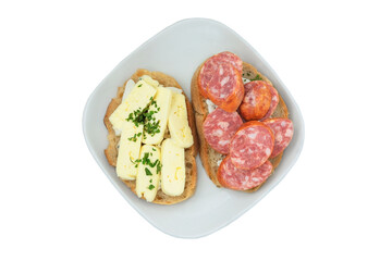 Slices of bread with sausage and soft cheese. Sandwiches for breakfast. Isolate on a white background. Top view.
