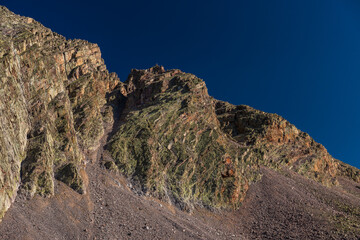 Mountain cliff with curved rocks