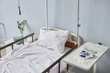 Background image of bed in hospital room interior, copy space