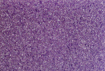 Foam rubber violet sponge, pores faceted close-up macro background wallpaper, uniform texture pattern
