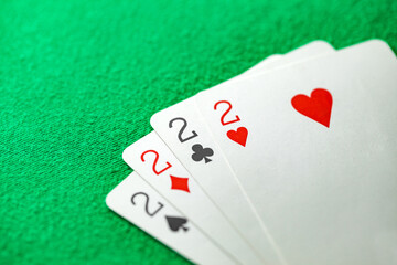 Playing cards, poker combination four of kind, quads, deuces of different suits, same value