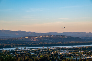 Plane Preparing to land in Portland PDX Airport with Washington Landscape