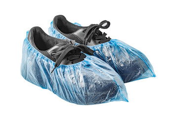 Medical blue shoe covers are worn on black shoes, isolated on white background with clipping path