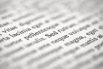 Lorem Ipsum on printed on paper on , middle of text, selective focus