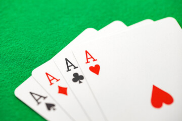 Playing cards, poker combination square on aces of different suits, same value