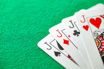 Playing cards, poker combination square on jacks of different suits, same value