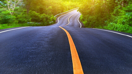 Countryside road and yellow line with trees on both sides, Curve of the road