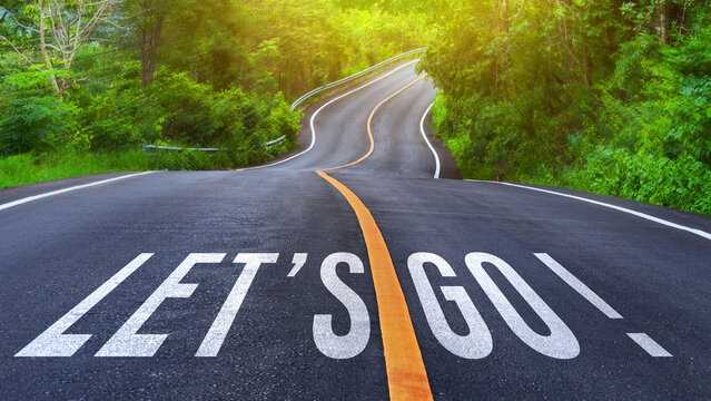 Word Go written on road in the middle of an empty asphalt road for business planning strategies and challenges or career path opportunities and change, road to success concept