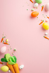 Easter decorations concept. Top view vertical photo of colorful easter eggs carrots and sprinkles on isolated pastel pink background with blank space