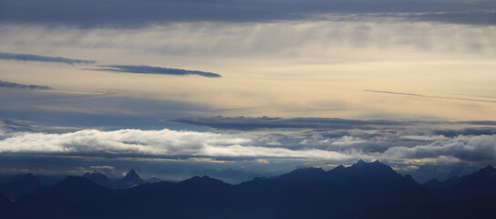 Fototapeta premium Moody sky over mountain ranges in Central Switzerland.