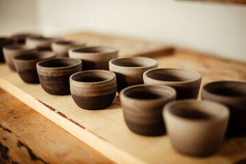 Obraz na płótnie Canvas hands making ceramic cups