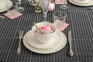 Table setting with painted egg and pussy willow branch in bowl served for Easter celebration