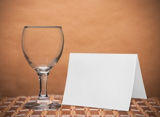 Empty Wine glass and blank card. Non-alcoholic month.