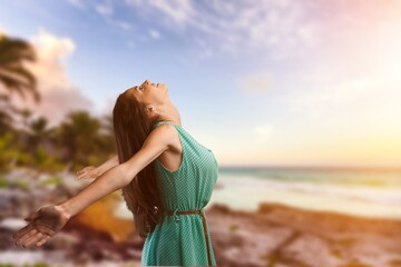 Attractive woman posing on sky background
