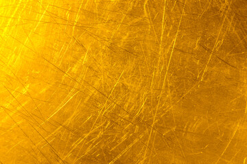 Texture of scratched golden surface as background, closeup