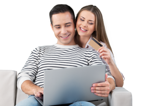Smiling Couple Using a Laptop and Holding a Credit Card