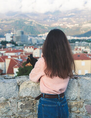 Fototapeta premium View of Budva old town streets, Budva Municipality and Riviera, resort on the Adriatic sea coast, Montenegro, sunny day with a blue sky, cathedral and citadel, travel to Montenegro