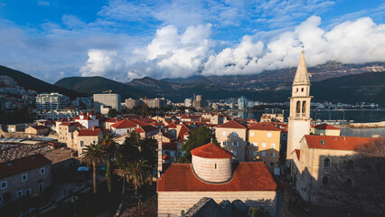 Obraz premium View of Budva old town streets, Budva Municipality and Riviera, resort on the Adriatic sea coast, Montenegro, sunny day with a blue sky, cathedral and citadel, travel to Montenegro