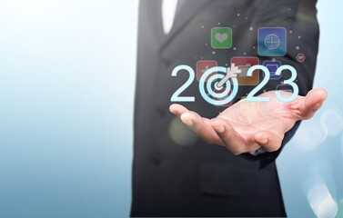 2023 concept, business person hold numbers with target