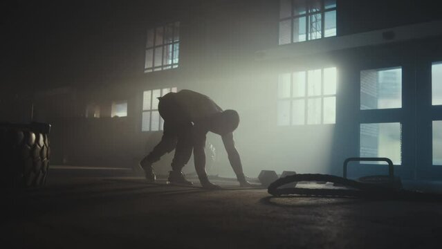 Young adult man doing push ups exercise during fitness sport workout .Grunge industrial urban training.4k slow motion video