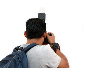 photographer with DSLR camera taking picture.