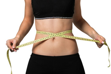 Female fitness model holding a tape measurer around her waist - weightloss concept