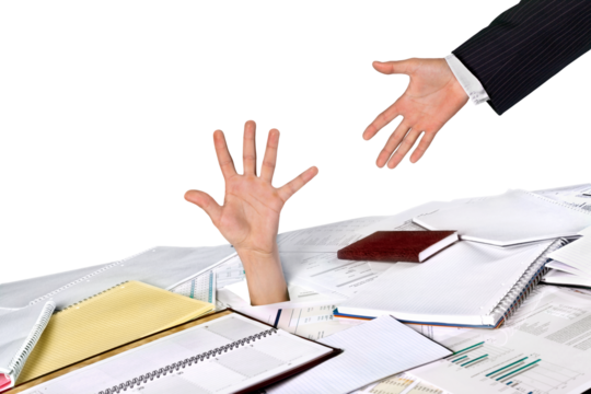 Businessman drowning in paperwork reaching for assistance and support
