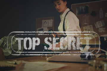 Classified information of investigation. Old fashioned detective working in office. Stamp Top Secret