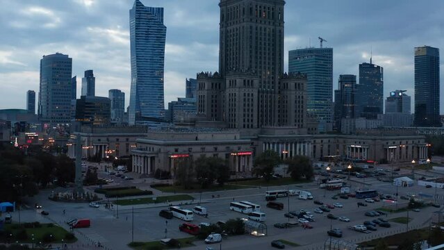 Rising footage of PKIN building. Old monumental tall building in downtown. Evening view of skyscrapers. Warsaw, Poland