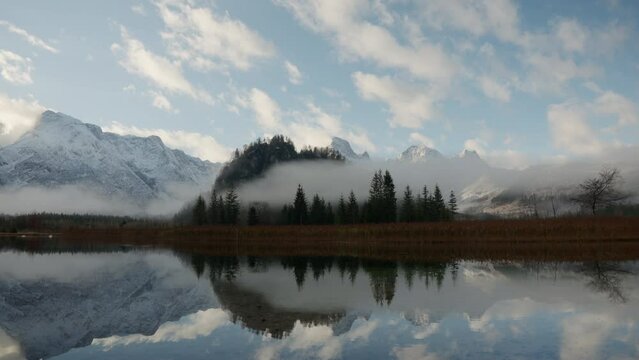 Beautiful reflection in an austrian mountain lake in winter
