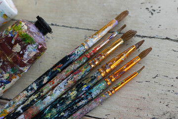 Picture of paintbrush and paint tube art supplies for hobby 
