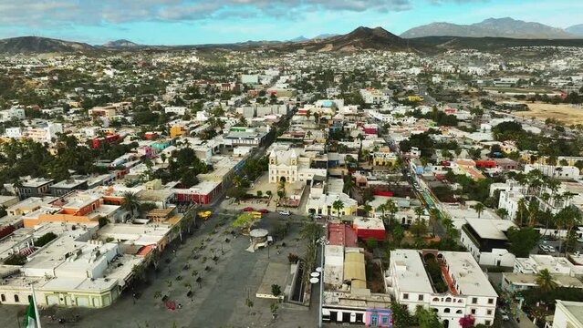 Old mexican town shot from a drone above view of the town in beautiful morning light. Todos Santos, san jose del cabo and cabo san lucas small towns. 