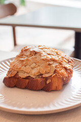 Freshly baked French croissant served in coffee shop