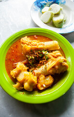 Lontong Kikil, a traditional food from Surabaya, East Java, Indonesia, made from curried cow's leg skin eaten with ketupat or rice wrapped in leaves.