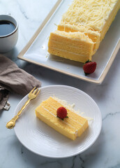 Soft Stim Cake with a layer of full cheese with a soft texture, cream cheese topping and a thick sprinkling of cheese. Perfect for snacks while relaxing with family and friends
