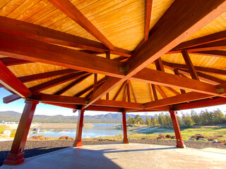 city park gazebo bandstand event wooden belvedere town square lake view roof - obrazy, fototapety, plakaty