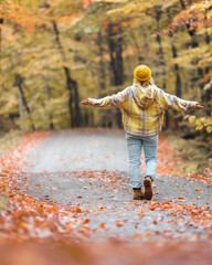 Enjoying An Autumn Walk In The Woods