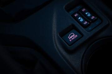 Activation button for all-wheel drive and vehicle locking systems x-mode