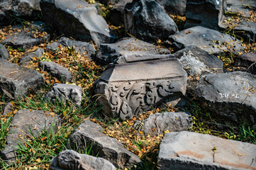 The carved images on the sandstone blocks laying on the floor awaiting restoration at Prasat Hin Phimai. Ancient Khmer castle at Nakhon Ratchasima, Thailand