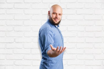 Happy young man posing on background