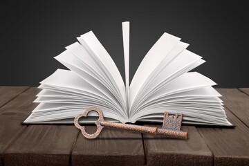 Antique key and open big bible book