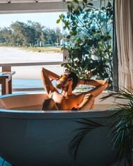 man relaxing in a jacuzzi at home