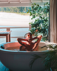 man relaxing in a jacuzzi at home