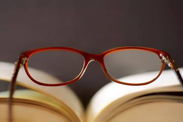 Open book with reading glasses