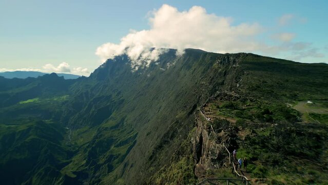 Drone flying fast over the Edge of the Maiido on La Reunion Island along the beautiful crater walls of the cirque du Mafate