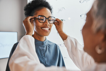 Glasses check, black woman and customer with store worker and optician looking at lense. Eye...