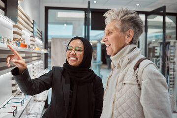 Decision, glasses and senior woman with an optician for help with eyewear and shopping for a frame....