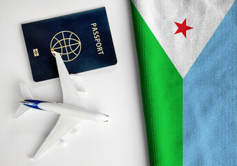 Flag of Djibouti with passport and toy airplane. Flight travel concept
