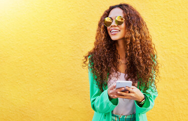 Fashion, phone and black woman isolated on wall background for social media, blog or creative ideas...