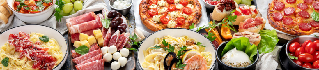 Italian food dishes on dark background.